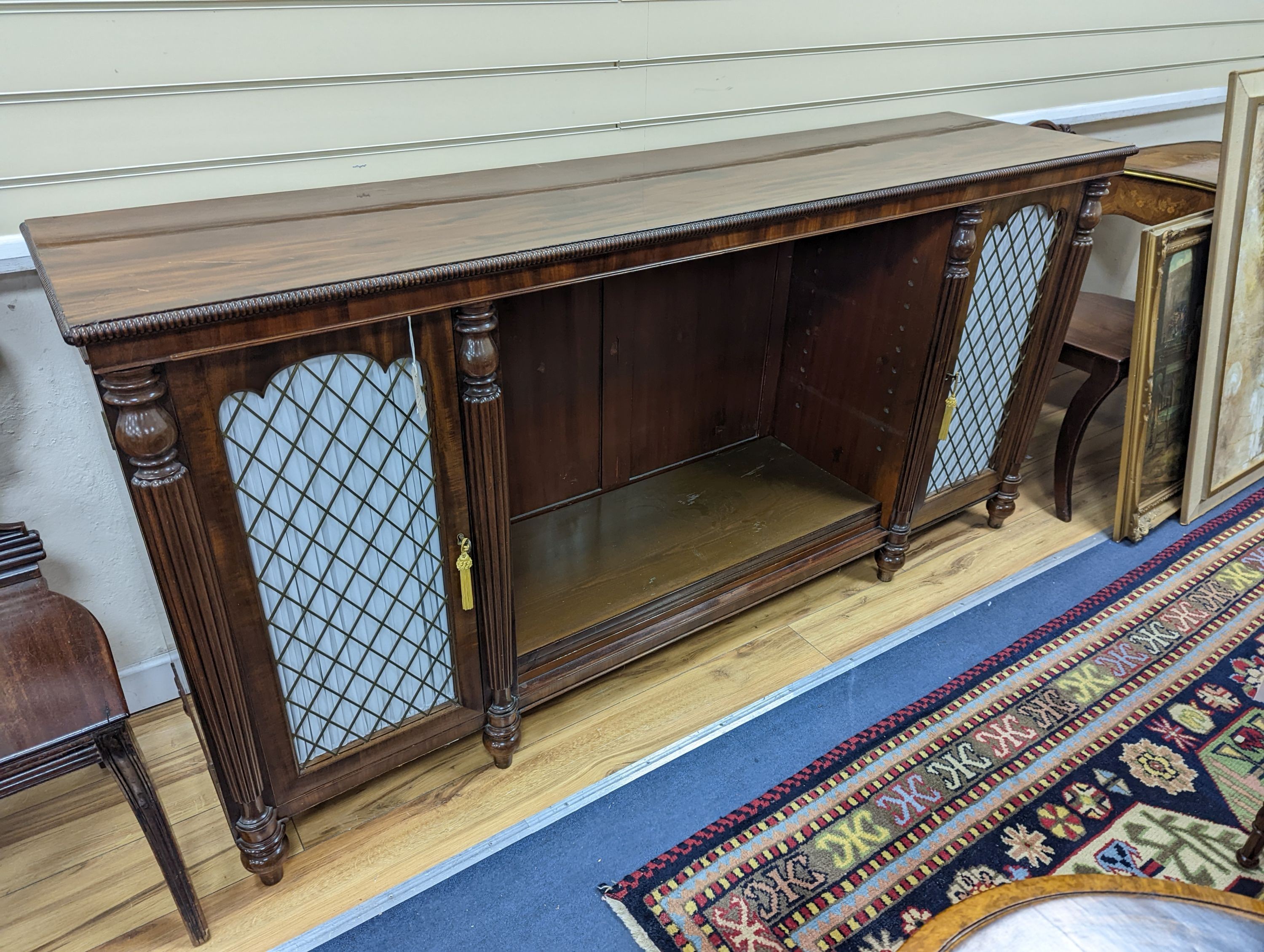 A Regency style mahogany two door dwarf cabinet, width 186cm, depth 45cm, height 91cm